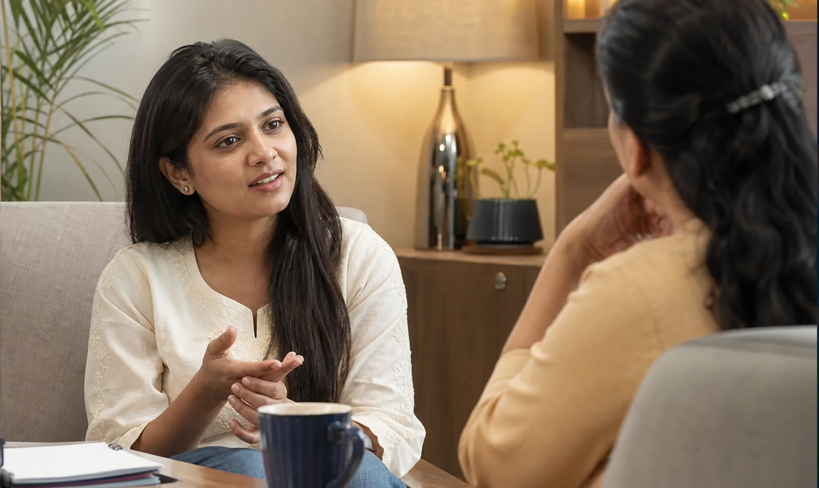 Indian woman in a thoughtful one-to-one guidance conversation